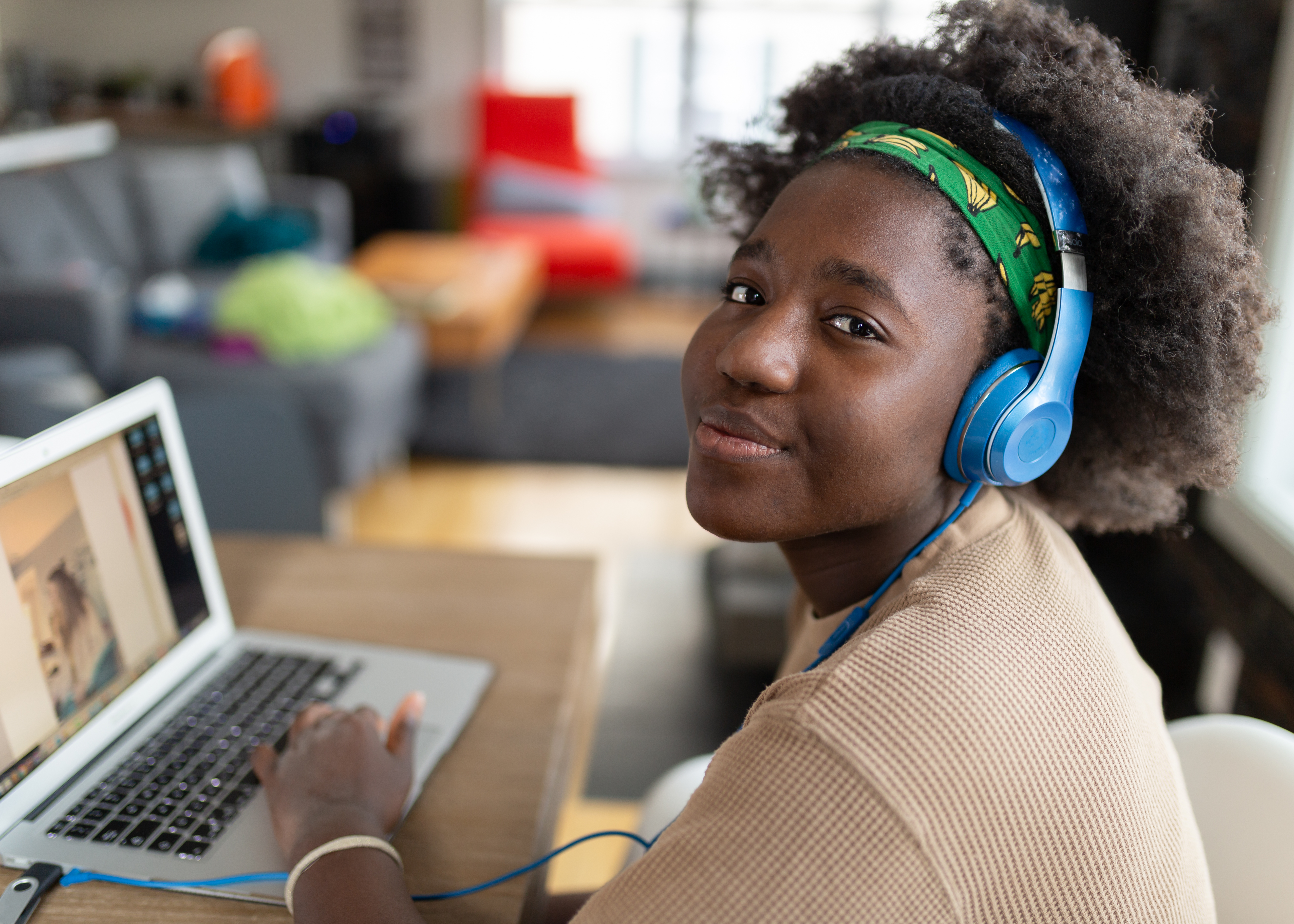 young Black woman working on a laptop