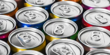 Photo of the tops of many energy drink cans