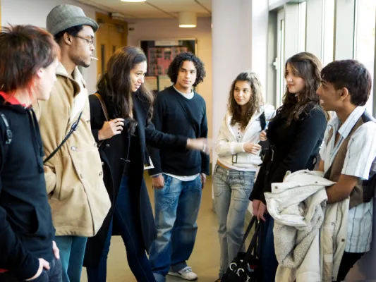 Group of students talking in the hallway