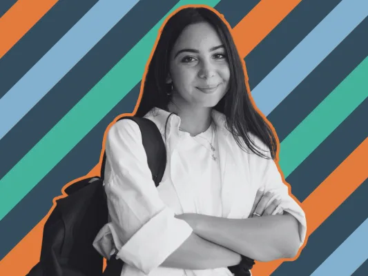 Photograph of a smiling female student with backpack, arms crossed, outlined in orange against diagonal teal, orange, light-blue, and dark-gray stripes. Portrait-style composition conveys confidence and student identity, with grayscale subject contrasting colorful geometric background.