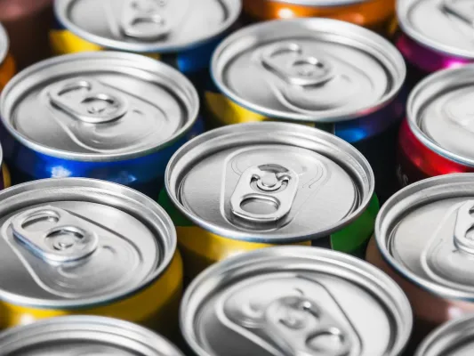 Photo of the tops of many energy drink cans