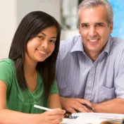 Teacher helping student