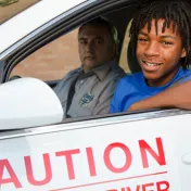 Young man learning to drive