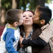 Women embraced by two children