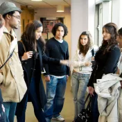 Group of students talking in the hallway