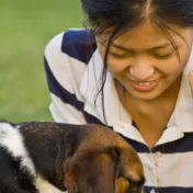 Girl playing with a dog