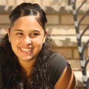 Smiling teen sitting on steps