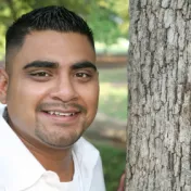 Man standing by tree