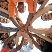 Youth forming circle with hands