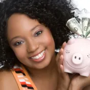 Woman holding a piggy bank 