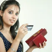 Girl looking at credit card