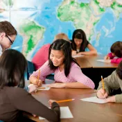 Students working near world map