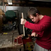 Man with disability working in a workshop