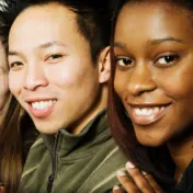 Photo of three young people smiling