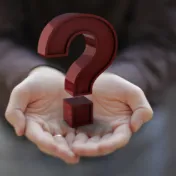 Graphic of two hands holding a question mark