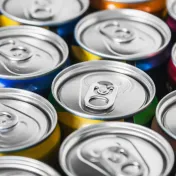 Photo of the tops of many energy drink cans